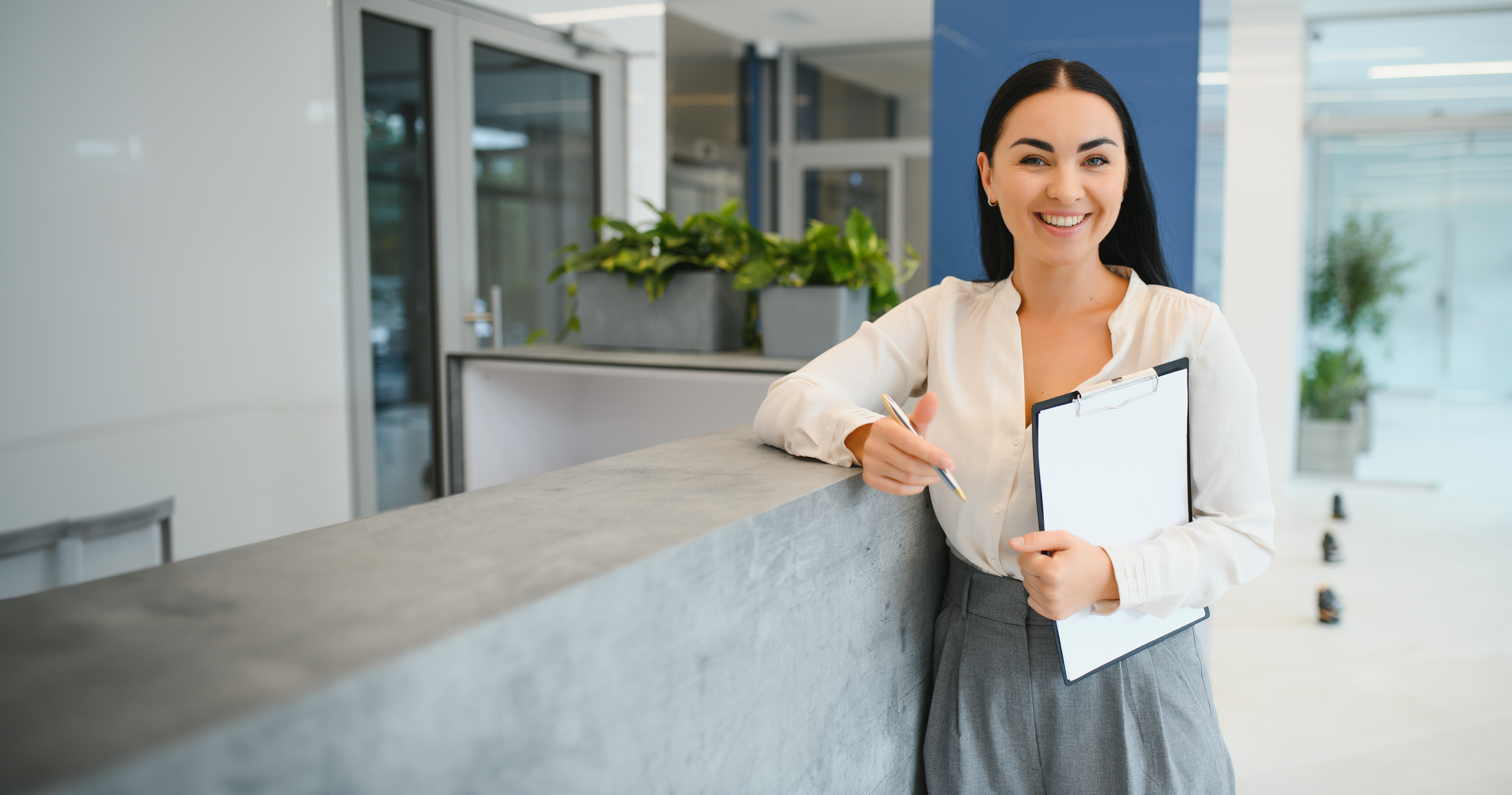 Business woman holding clip board 