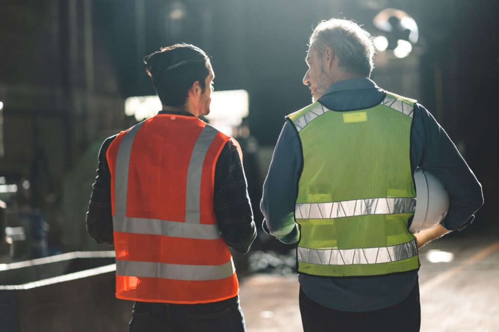 Health and safety professionals carrying out a check on a work place
